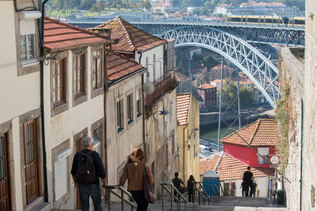 the Ponte de Dom Luis 1 at the old town on the Douro River in Ribeira in the city centre of Porto in...