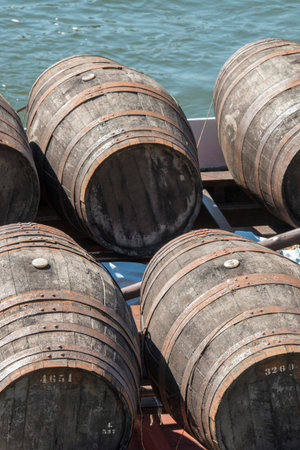 the port wine Boats at the waterfront with the old town on the Douro River in Ribeira in the city...