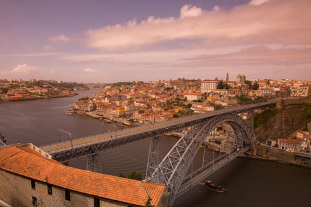 the Ponte de Dom Luis 1 at the old town on the Douro River in Ribeira in the city centre of Porto in...