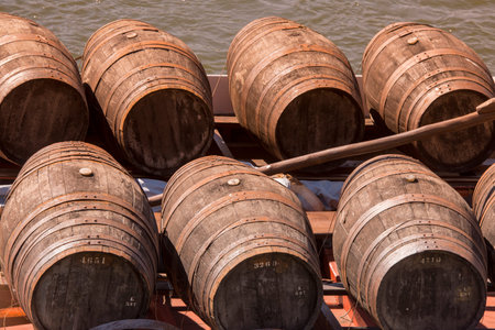 the port wine Boats at the waterfront with the old town on the Douro River in Ribeira in the city...