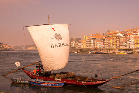 the port wine Boats at the waterfront with the old town on the Douro River in Ribeira in the city...
