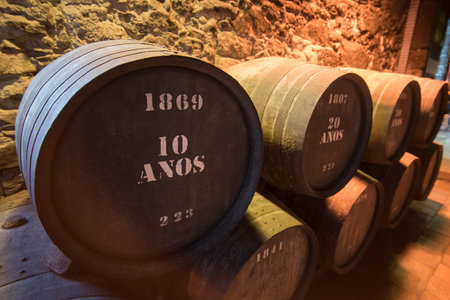 one of the Port wine Cellar of Burmester at the waterfront  on the Douro River in Ribeira in the city centre of Porto in Porugal in Europe.のeditorial素材