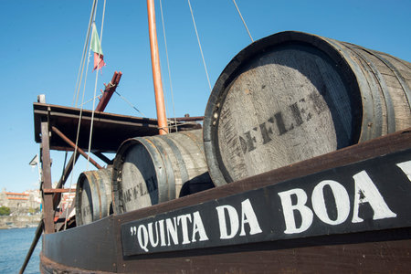 the port wine Boats at the waterfront with the old town on the Douro River in Ribeira in the city...