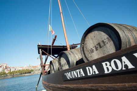 the port wine Boats at the waterfront with the old town on the Douro River in Ribeira in the city...