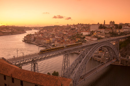 the Ponte de Dom Luis 1 at the old town on the Douro River in Ribeira in the city centre of Porto in...