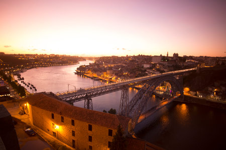 the Ponte de Dom Luis 1 at the old town on the Douro River in Ribeira in the city centre of Porto in...