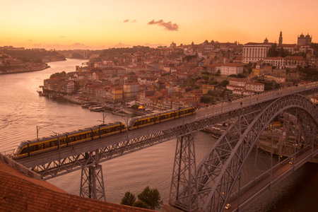 the Ponte de Dom Luis 1 at the old town on the Douro River in Ribeira in the city centre of Porto in...