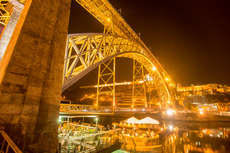 the Ponte de Dom Luis 1 at the old town on the Douro River in Ribeira in the city centre of Porto in...