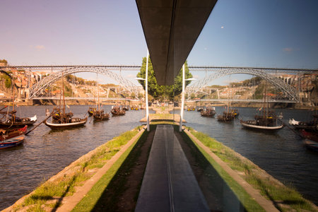 the port wine Boats at the waterfront with the Ponte de Dom Luis 1 and the old town on the Douro...
