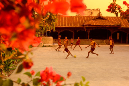 Young Monks Play Soccer in a Pagoda in the town of Nyaungshwe at the Inle Lake in the Shan State in...