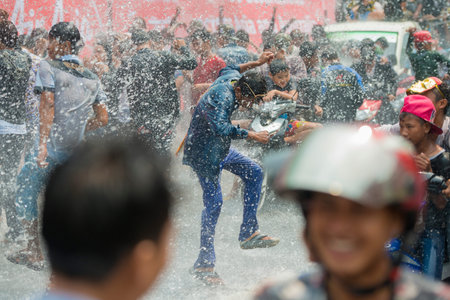 People at the Waterparty at the Thingyan Water Festival at the Myanmar New Year in the city centre...