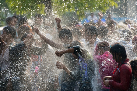 People at the Waterparty at the Thingyan Water Festival at the Myanmar New Year in the city centre...