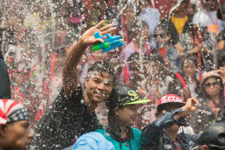 People at the Waterparty at the Thingyan Water Festival at the Myanmar New Year in the city centre...
