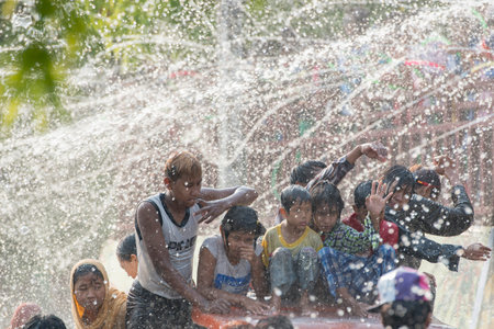 People at the Waterparty at the Thingyan Water Festival at the Myanmar New Year in the city centre...