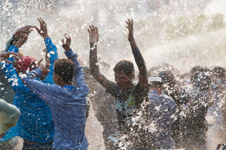 People at the Waterparty at the Thingyan Water Festival at the Myanmar New Year in the city centre...