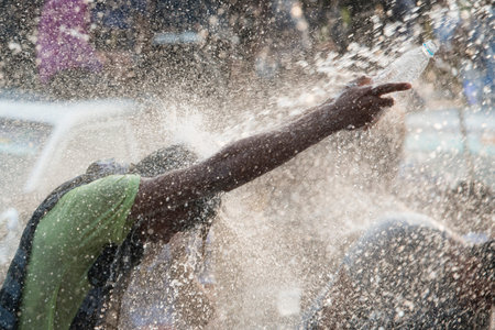 People at the Waterparty at the Thingyan Water Festival at the Myanmar New Year in the city centre...