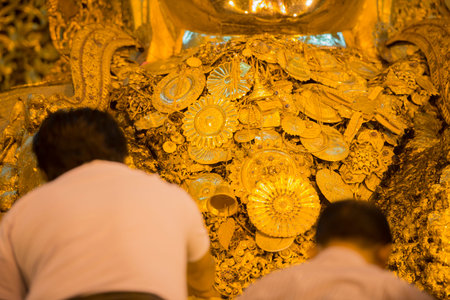 The Mahamuni Buddha at the Mahamuni temple in the City of Mandalay in Myanmar in Southeastasia.のeditorial素材