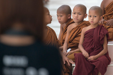 young monks in the Shwedagon Paya Pagoda in the City of Yangon in Myanmar in Southeastasia.のeditorial素材