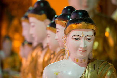 Buddhas in the Shwedagon Paya Pagoda in the City of Yangon in Myanmar in Southeastasia.