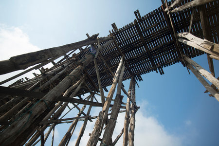 the Wang Kka Wooden Bridge in the  landscape at the Khao Laem Lake in the Village of Sangkhlaburi north of the City of Kanchanaburi in Central Thailand in Southeastasia.のeditorial素材