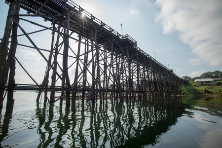 the Wang Kka Wooden Bridge in the  landscape at the Khao Laem Lake in the Village of Sangkhlaburi north of the City of Kanchanaburi in Central Thailand in Southeastasia.のeditorial素材