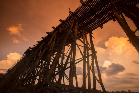 the Wang Kka Wooden Bridge in the  landscape at the Khao Laem Lake in the Village of Sangkhlaburi north of the City of Kanchanaburi in Central Thailand in Southeastasia.のeditorial素材
