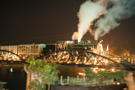 a Sound and light show at the Death Railway Bridge over the River Kwai of the Burma-Thailand Railway...