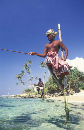 Fishermen at the coast of Weligama in the southwest of Sri Lanka in Asien.のeditorial素材