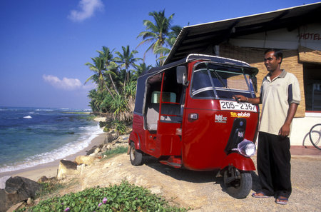 a beach at the coast of Hikaduwa at the westcoast of Sri Lanka in Asien.