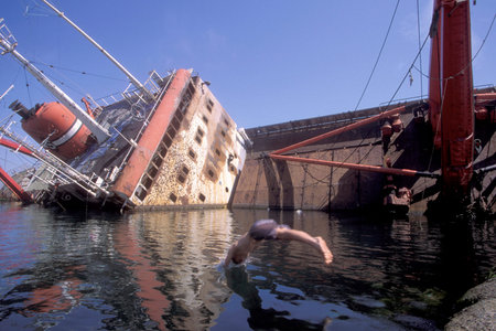 childern play at a Ship wreck in the Bospurus in the old town of the city Istanbul in Turkey. ...