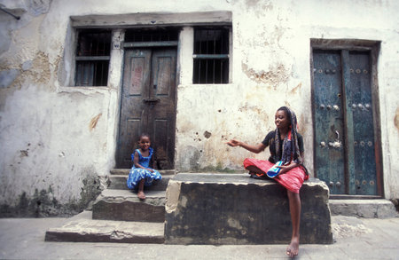 people in the Old Town of Stone Town on the Island of Zanzibar in Tanzania.  Tanzania, Zanzibar, Stone Town, October, 2004のeditorial素材