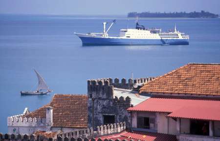a Transport boat and Ferry at the Indian Ocean in front of the Old Town of Stone Town on the Island...