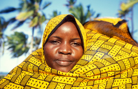 a local Women in the Village of Bwejuu on the Island of Zanzibar in Tanzania.  Tanzania, Zanzibar,...