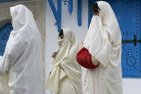 Tunisian Muslim Women in traditional Tunisia clothes in the Old Town of Sidi Bou Said near the City of Tunis in north of Tunisia in North Africa,  Tunisia, Sidi Bou Said, March, 2009のeditorial素材