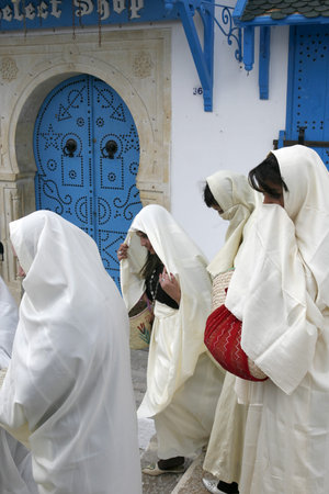 Tunisian Muslim Women in traditional Tunisia clothes in the Old Town of Sidi Bou Said near the City of Tunis in north of Tunisia in North Africa,  Tunisia, Sidi Bou Said, March, 2009のeditorial素材