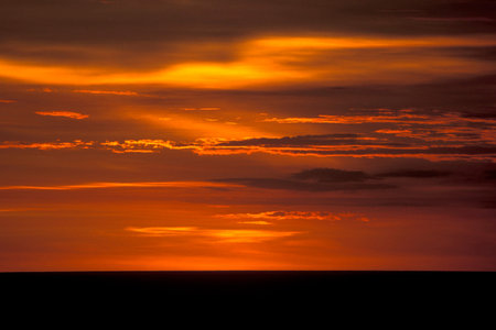 sunset at the Kuta Beach in the Town of Kuta on the Island Bali in Indonesia.  Indonesia, Bali,...