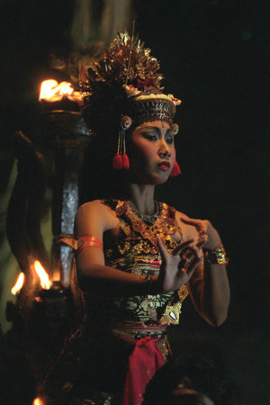 A Women at Traditional Bali Kecak Dance near the Temple of Ulu Watu Tempel on the Island Bali in...