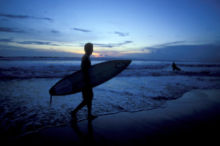 Surfer on the Nusa Dua Beach near Nusa Dua Town in the south of Island Bali in Indonesia.  Indonesia, Bali, March, 5, 2001のeditorial素材