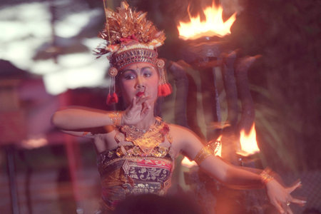 A Women at Traditional Bali Kecak Dance near the Temple of Ulu Watu Tempel on the Island Bali in...