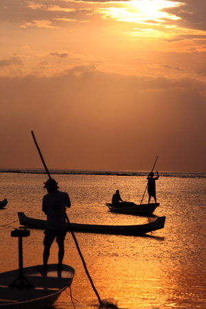 people at work on a seawead plantation on the Island Nusa Lembongan Island near the island Bali in indonesia in southeastasiaのeditorial素材