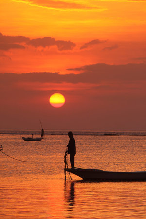 people at work on a seawead plantation on the Island Nusa Lembongan Island near the island Bali in indonesia in southeastasiaのeditorial素材
