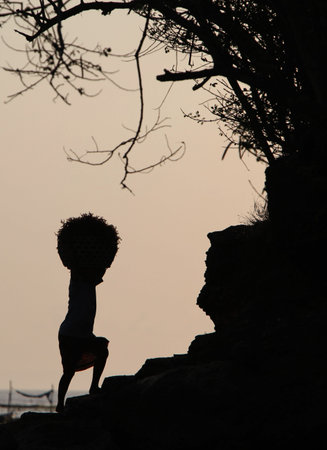 people at work on a seawead plantation on the Island Nusa Lembongan Island near the island Bali in indonesia in southeastasiaのeditorial素材