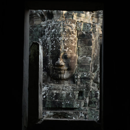 Stone Faces at the Bayon Temple the Tempel Ruins of Angkor Thom in the Temple City of Angkor near the City of Siem Reap in the west of Cambodia.  Cambodia, Siem Reap, April 2014のeditorial素材