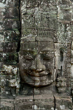 Stone face at the Bayon Temple the Tempel Ruins of Angkor Thom in the Temple City of Angkor near the City of Siem Reap in the west of Cambodia.  Cambodia, Siem Reap, April 2014のeditorial素材