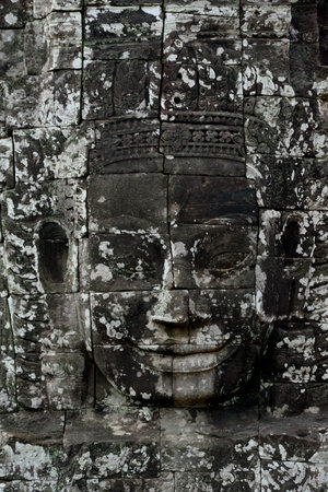 Stone face at the Bayon Temple the Tempel Ruins of Angkor Thom in the Temple City of Angkor near the City of Siem Reap in the west of Cambodia.  Cambodia, Siem Reap, April 2014のeditorial素材