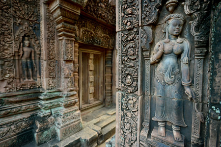 stone carving at a door of the Tempel Ruins of  Banteay Srei about 32 Km north of the Temple City of Angkor near the City of Siem Reap in the west of Cambodia.  Cambodia, Siem Reap, April 2014のeditorial素材