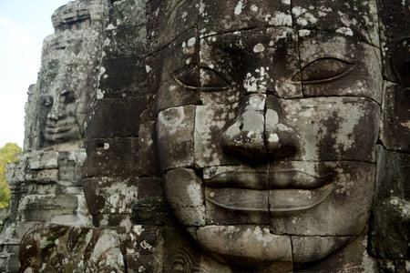 Stone face at the Bayon Temple the Tempel Ruins of Angkor Thom in the Temple City of Angkor near the...