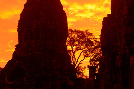 sunset at the Bayon Temple the Tempel Ruins of Angkor Thom in the Temple City of Angkor near the City of Siem Reap in the west of Cambodia.  Cambodia, Siem Reap, April 2014のeditorial素材