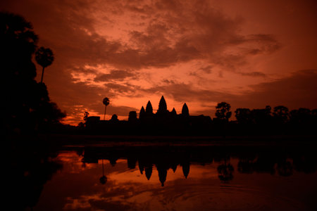 Sunrise at the Angkor Wat Temple in the Temple City of Angkor near the City of Siem Reap in the west of Cambodia.   Cambodia, Siem Reap, April 2014のeditorial素材