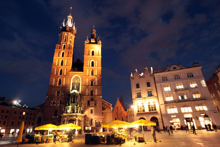 the Rynek Glowny square with the church of St Mary in the old town of Cracow in Poland in east Europe.のeditorial素材